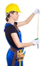 Woman builder in the uniform holds a brick Royalty Free Stock Photo