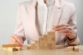 Woman building stairs at table, closeup. Career promotion concept