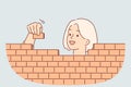 Woman builds brick wall by carefully stacking blocks, for concept of creating business structures Royalty Free Stock Photo