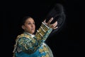 Woman bullfighter salutes with his montera