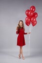 Woman with a bunch of balloon at Valentine`s Day