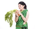 Woman with a bunch of carrots Royalty Free Stock Photo