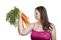 Woman with a bunch of carrots Royalty Free Stock Photo