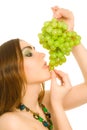 Woman with bunch of green grapes