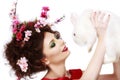 Woman with a bunny, eggs and flowers spring easter concept Royalty Free Stock Photo