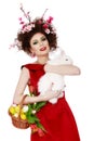 Woman with a bunny, eggs and flowers spring easter concept Royalty Free Stock Photo