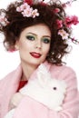 Woman with a bunny, eggs and flowers spring easter concept Royalty Free Stock Photo