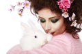 Woman with a bunny, eggs and flowers spring easter concept Royalty Free Stock Photo