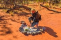 Woman burns bush plants