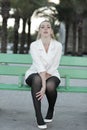 Woman on the bus stop bench