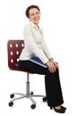 Woman in business dress sitting on chair