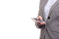 Woman business in shirt and jacket is holding a mobile phone smartphone Royalty Free Stock Photo