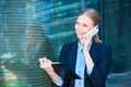 Woman in business suit carries folder with documents and smiles while talking Royalty Free Stock Photo