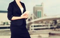 Woman in business suit on a city building background. filtered image Royalty Free Stock Photo