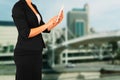 Woman in business suit on a city building background. filtered image. Royalty Free Stock Photo