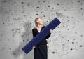 Woman in business suit holding big ruler Royalty Free Stock Photo