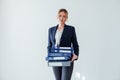 Woman in business suit at work in office with folders for documents and papers Royalty Free Stock Photo