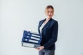 Woman in business suit at work in office with folders for documents and papers Royalty Free Stock Photo