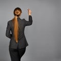 Woman in business suit writing with chalk Royalty Free Stock Photo