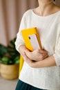 Woman businessman holding yellow notepad and smartphone Royalty Free Stock Photo