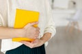 Woman businessman holding yellow notepad Royalty Free Stock Photo