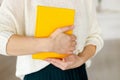 Woman businessman holding yellow notepad Royalty Free Stock Photo