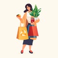 woman buyer holding shopping bags with fruits and vegetables organic natural food eco local grown products world Royalty Free Stock Photo