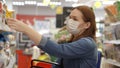 Woman Buyer wearing a protective mask.