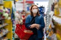 Woman Buyer wearing a protective mask.