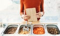 Woman buying bulk foods in plastic free grocery store