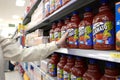 Woman buying Canada dry Mott's Clamato Royalty Free Stock Photo