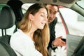 Woman buying car from salesperson