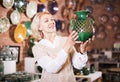 Woman buying ceramic tableware Royalty Free Stock Photo