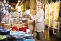 Woman buying ceramic tableware Royalty Free Stock Photo