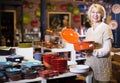 Woman buying ceramic tableware Royalty Free Stock Photo