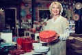 Woman buying ceramic ware Royalty Free Stock Photo