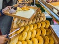 Woman buying donuts in baking store. Female choosing and buying fresh tasty pastry from shelves. Young woman choose freshly baked Royalty Free Stock Photo