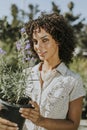 Woman buying flowers at a nursery