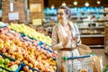 Woman buying food in the supermarket Royalty Free Stock Photo