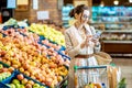 Woman buying food in the supermarket Royalty Free Stock Photo