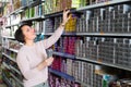 Woman buying hair colourant in store