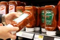 Woman buying Heinz jalapeno ketchup