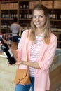 woman buying and holding bottle wine Royalty Free Stock Photo