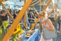 Woman buying meal at street food festival. Royalty Free Stock Photo