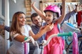 Woman buying new bicycle and helmet for little girl in bike shop Royalty Free Stock Photo