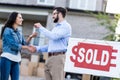 woman buying new house with sold signboard Royalty Free Stock Photo