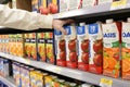 Woman buying Pomme apple juice