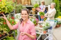Woman buying potted flower in garden shop Royalty Free Stock Photo