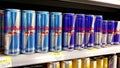 Woman buying Red Bull sugarfree energy drink