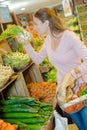 Woman buying some carrots Royalty Free Stock Photo